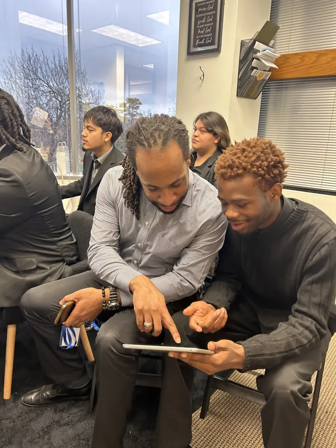 Ireti Provisions team reviewing work together